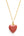 Gold necklace with a red heart pendant on a white background