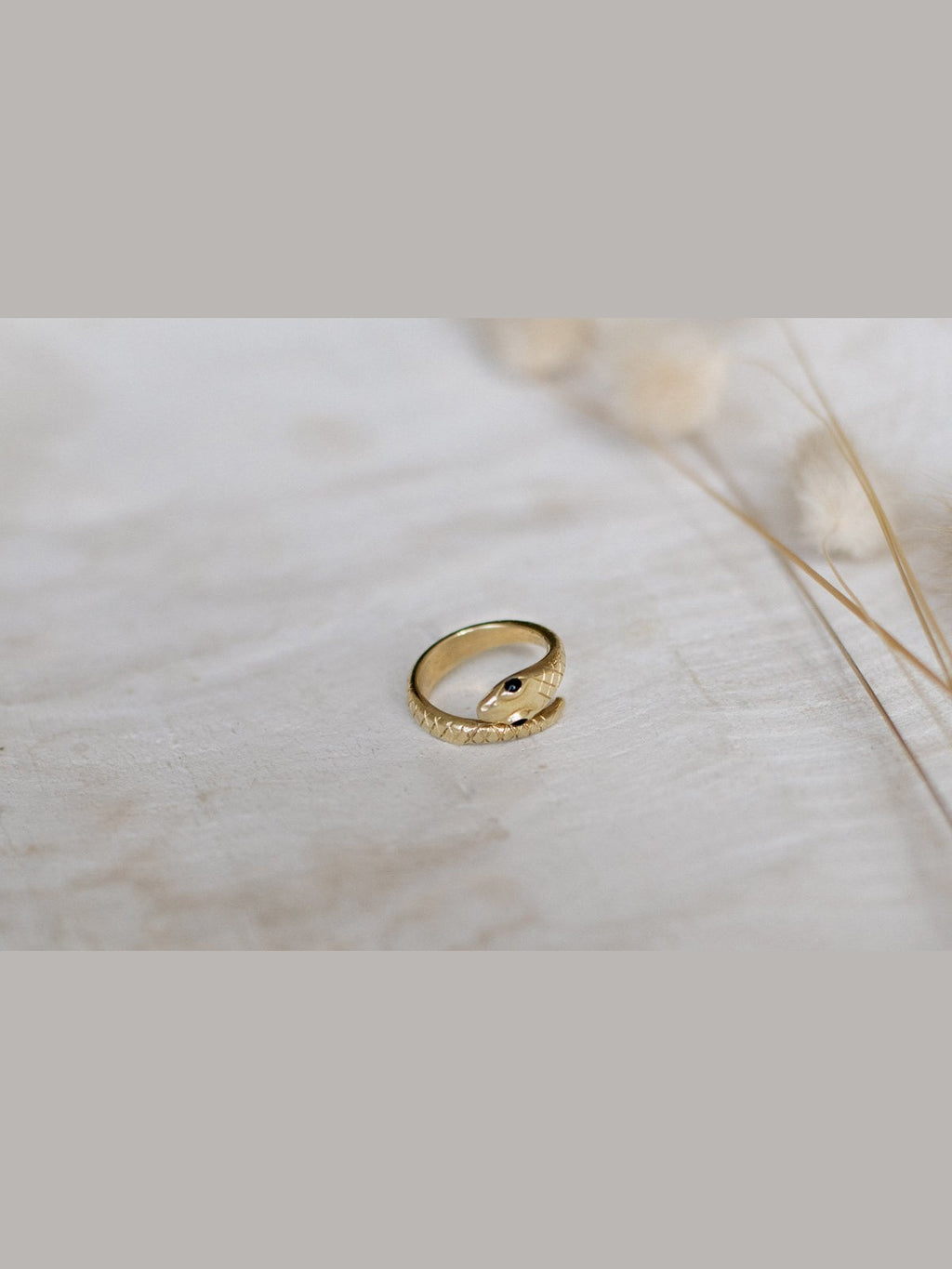 Gold ring on a marble surface