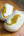 White slippers with cheetah print on a wooden surface