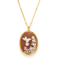 Gold necklace with a pendant featuring a bird and floral design on a white background