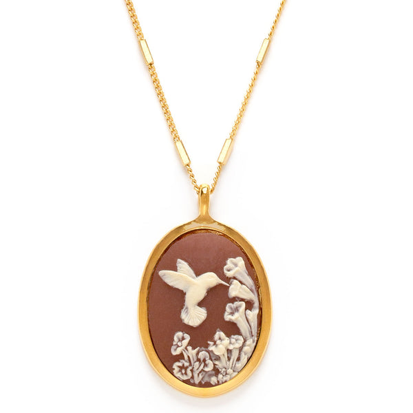 Gold necklace with a pendant featuring a bird and floral design on a white background