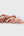 Set of pink hair ties on a light gray background