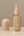 Kitsch Warm Sugar hair perfume bottle with cap on a neutral background