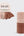 A pack of Kitsch Seamless Elastic Hair Ties shown on a light gray background, with the retail header card visible on the left and two stacks of hair ties on the right. The hair ties come in soft neutral shades including blush pink, beige, tan, and medium brown.