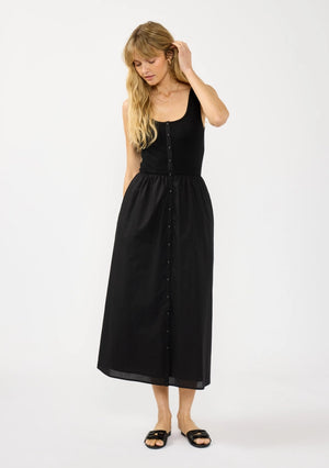 Woman wearing a black dress on a white background