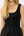 Black sleeveless dress with button details on a white background
