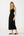Woman wearing a black sleeveless dress on a white background