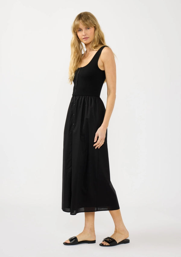 Woman wearing a black sleeveless dress on a white background