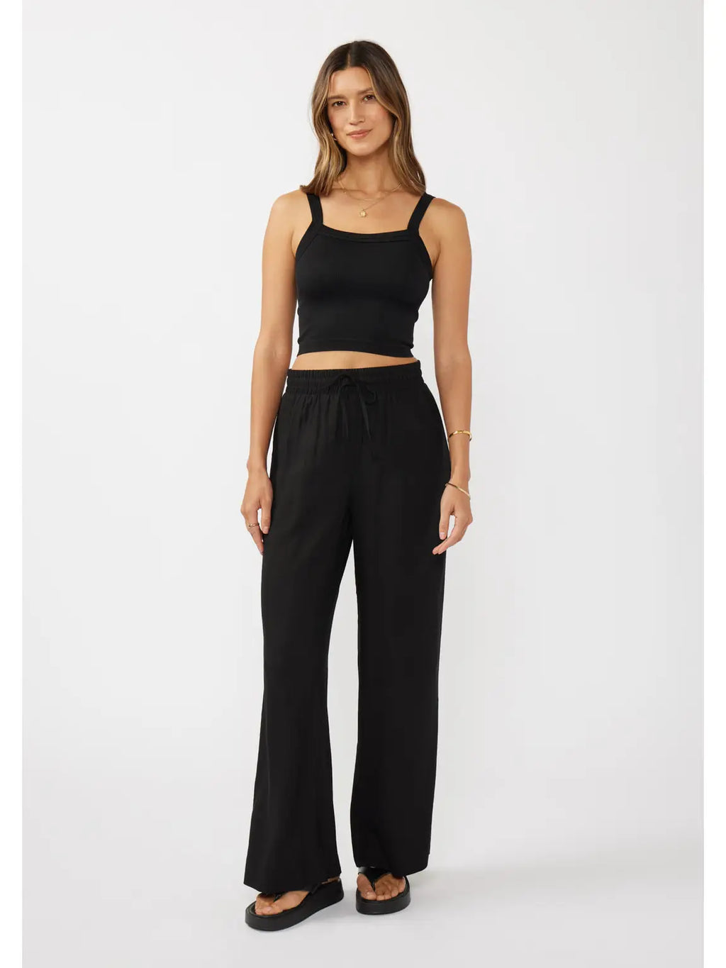 woman wearing black pants and tank top