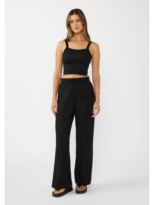 woman wearing black pants and tank top