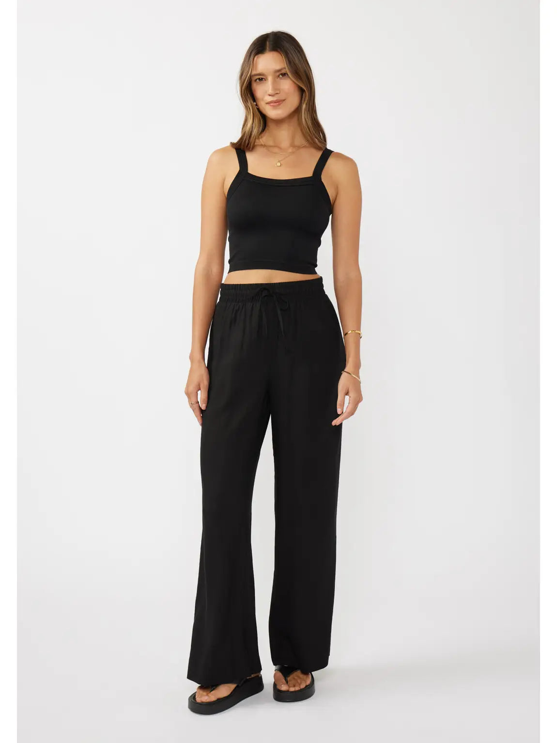 woman wearing black pants and tank top