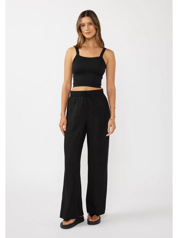 woman wearing black pants and tank top
