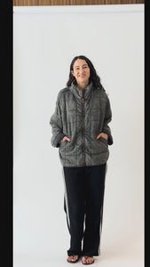 girl in grey jacket and black pants